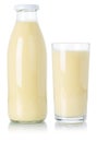 Banana smoothie fruit juice drink milkshake milk shake in a bottle and glass isolated on white Royalty Free Stock Photo