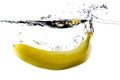 Banana splashing into water Royalty Free Stock Photo