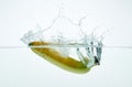 Banana splashing in water. on white background. Royalty Free Stock Photo