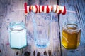 Banana and strawberry skewer on top of empty glass