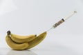 Banana and syringe with pills Royalty Free Stock Photo