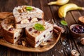 Banana toasts with walnut, cranberries and cinnamon