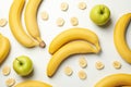 Bananas and apples on white background top view. Fresh fruit Royalty Free Stock Photo