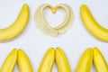 Bananas and banana heart on white