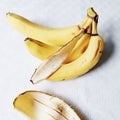 3 bananas and a banana peel