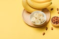 Bananas and banana slices on a plate of wood Royalty Free Stock Photo