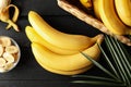 Bananas. Basket with bananas and bowl with slices on background Royalty Free Stock Photo