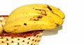 Bananas basket on white background Royalty Free Stock Photo