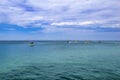 Bananas, boats, catamarans and other tourist ships on the horizon of the Black Sea. Summer seascape in Zaliznyi port Kherson