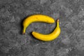 Bananas with defects on dark gray background Royalty Free Stock Photo