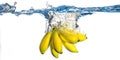 Bananas falling in water Royalty Free Stock Photo