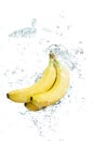 Bananas falling in water Royalty Free Stock Photo