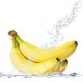 Bananas falling in water Royalty Free Stock Photo