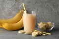 Bananas and juice against background. Fresh fruit Royalty Free Stock Photo