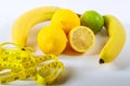 The concept of healthy eating, weight loss, . Bananas, lemon, measuring tape on the table