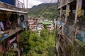 Banaue, Ifugao, Philippines -View of a rural town nestled in green hills as seen between 2 buildings Royalty Free Stock Photo