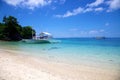 Banca boat on white sand tropical beach on Malapascua island, Philippines