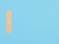 Band-aid  on a blue background Royalty Free Stock Photo