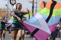 Band majorettes perform flag waving dancing skills on street during the annual brass band exhibition