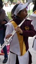 Band march girl playing a long silver flute