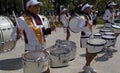 Band march girls in uniform playing drums