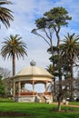 Band rotunda surrounded by old trees, Auckland Domain, New Zealand Royalty Free Stock Photo