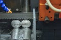 The  band saw machine cutting raw metals rods . Royalty Free Stock Photo