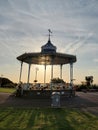 Band stand adorned in moving sun and flowers for Queen Elizabeth.