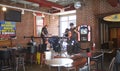 A Band Trio Performs Live Music on Beale Street.