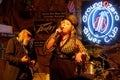 Band of a woman singer and a guitarist during a show