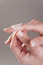 Bandage on female finger Royalty Free Stock Photo