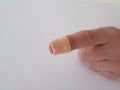 Bandage on fingertip. Cut finger band. Finger bandage. Royalty Free Stock Photo