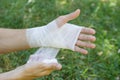 Bandage on a hand wrist, an independent emergency in nature. White bandage