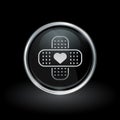 Bandage and heart icon inside round silver and black emblem