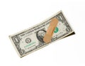 Bandage on one dollar bill on world financial economical crisis Royalty Free Stock Photo