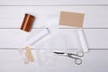 Bandage rolls and medical supplies on white wooden table, flat lay Royalty Free Stock Photo