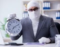 Bandaged businessman worker working in the office doing paperwor