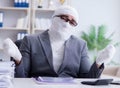 Bandaged businessman worker working in the office doing paperwor