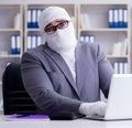 Bandaged businessman worker working in the office doing paperwor