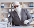 Bandaged businessman worker working in the office doing paperwor