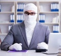 Bandaged businessman worker working in the office doing paperwor