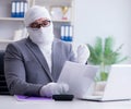 Bandaged businessman worker working in the office doing paperwor