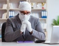 Bandaged businessman worker working in the office doing paperwor