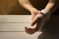 Bandaged hand in light and shadow Royalty Free Stock Photo