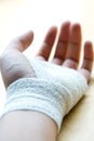 Bandaged wrist resting Royalty Free Stock Photo