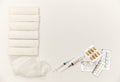 Bandages, syringes, pills, pills and vitamins on a white background, top view. Concept of first aid kit. White Royalty Free Stock Photo