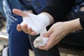 Close up of bandaging injured hand after an accident Royalty Free Stock Photo