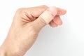 Bandaid on the thumb split background Royalty Free Stock Photo