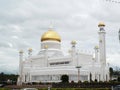White facade and golden domes of the Sultan Omar Ali Saifuddin Mosque in Brunei