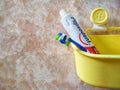 Bandar Seri Begawan / Brunei - May 19 2019 : Image of Tooth Brush and Pepsodent Toothpaste in a yellow bucket